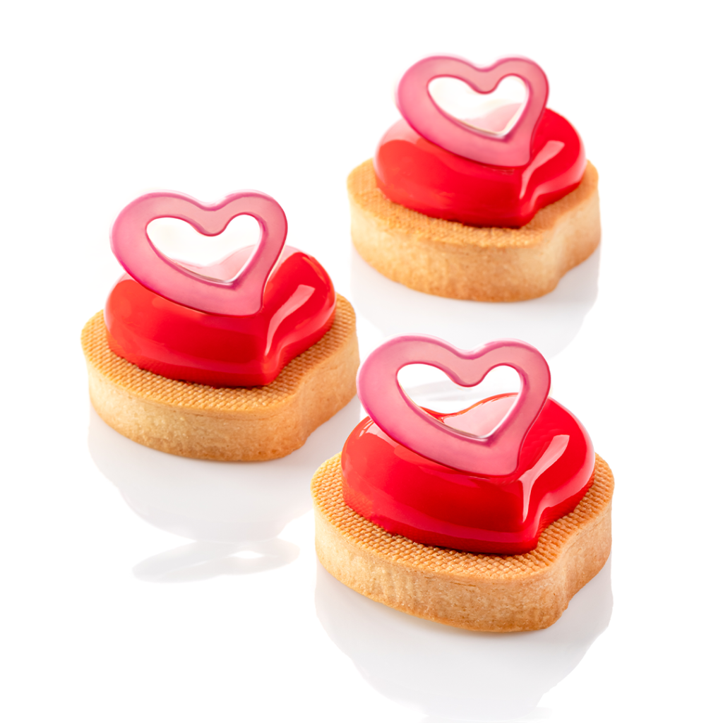 valentines tart in shape of heart with chocolate decoration - open heart