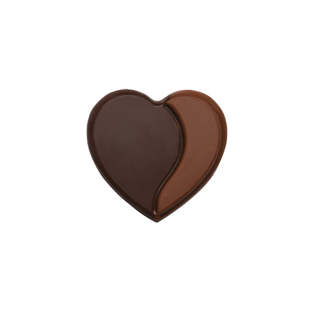 A 3D heart-shaped Valentine's chocolate decoration divided vertically into two smooth sections: one side is dark chocolate and the other is milk chocolate